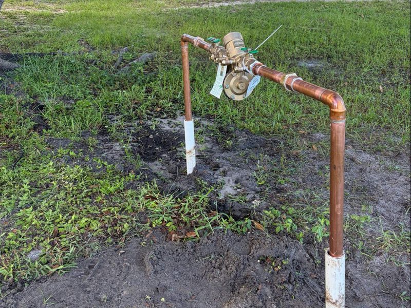 New backflow preventer set on copper risers at a commercial building
