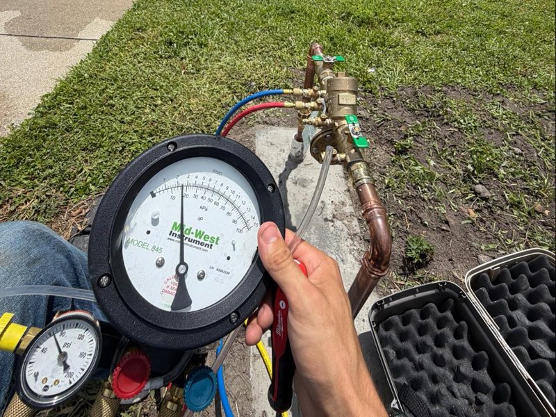 Annual backflow test at a commercial property, gauge on the assembly