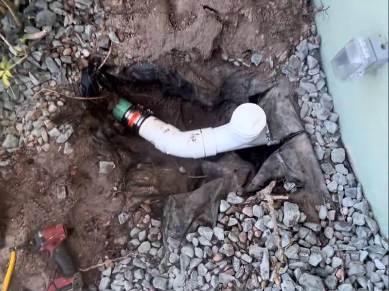 New cleanout tied into the sewer line beside the house