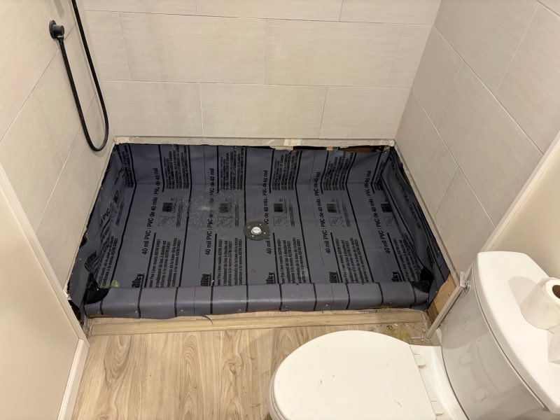 New shower pan liner and drain set, ready for tile
