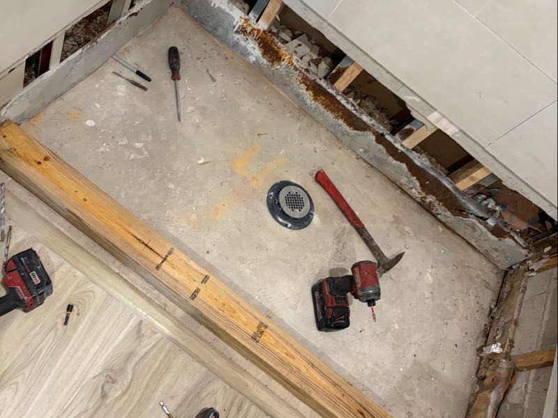 Failed shower pan torn out down to the slab