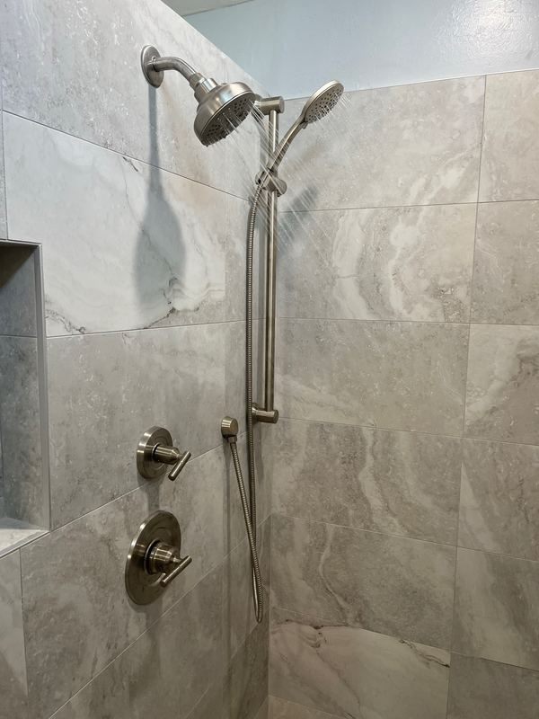 Shower valve and trim set on a finished bathroom remodel