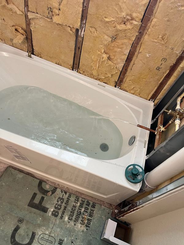 Tub and shower rough-in, inspected before the wall closes