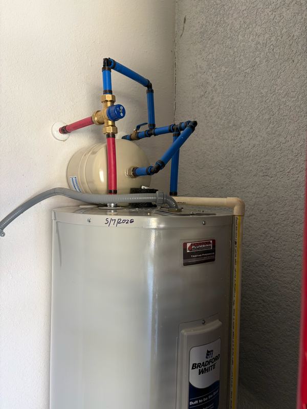 Water heater with thermal expansion tank and PEX connections