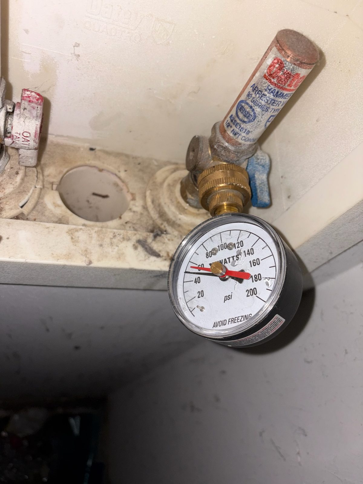 Pressure gauge on the service — the first check on any water complaint